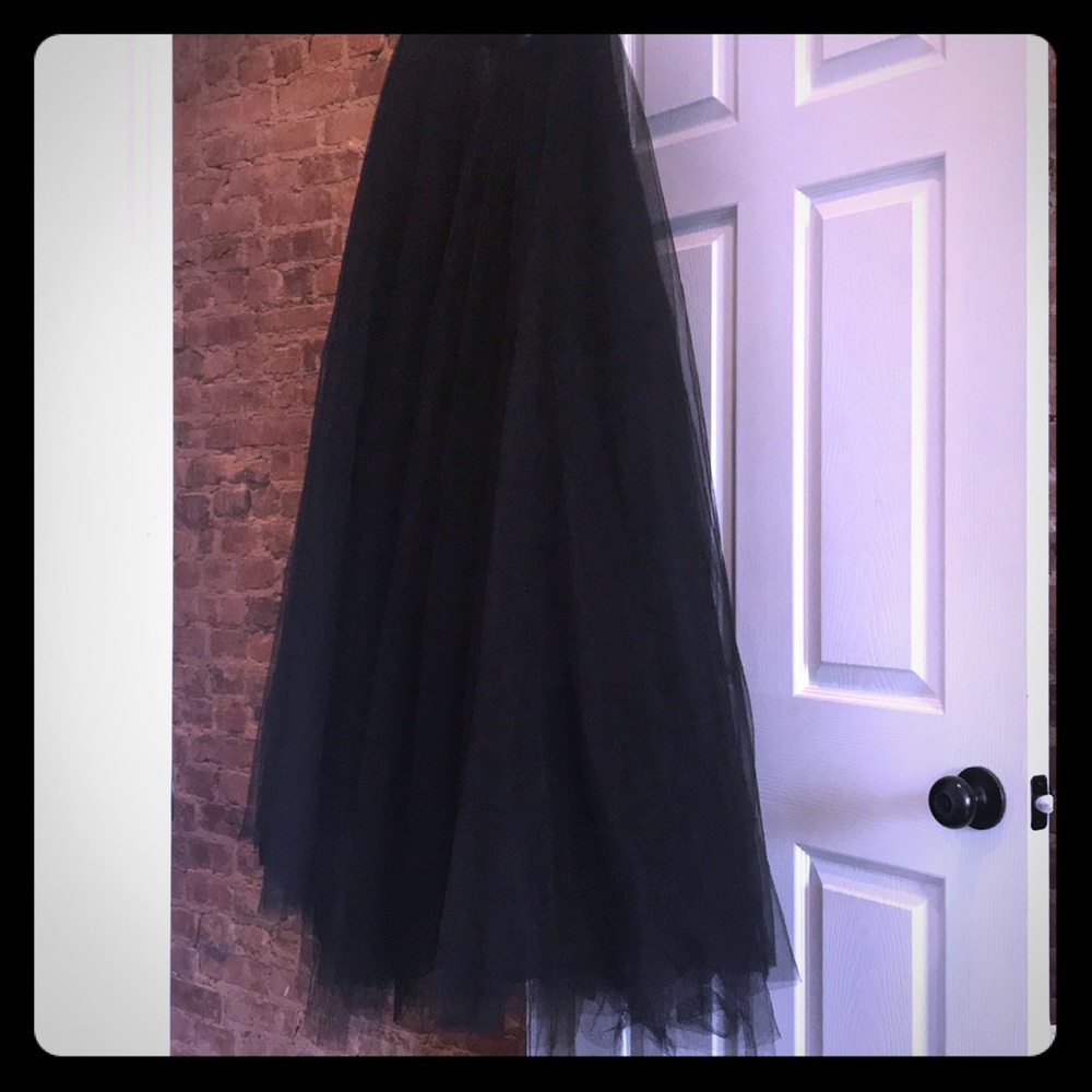 Black, floor length tulle skirt, with snap closure
